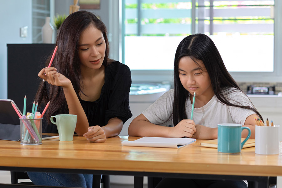 student and tutor together at a desk in Kansascity